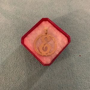 Gold “E” charm